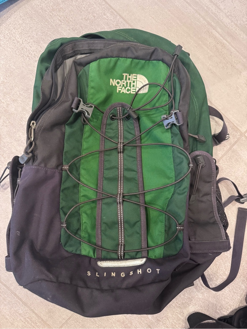 The North Face Slingshot Backpack in Green and Black